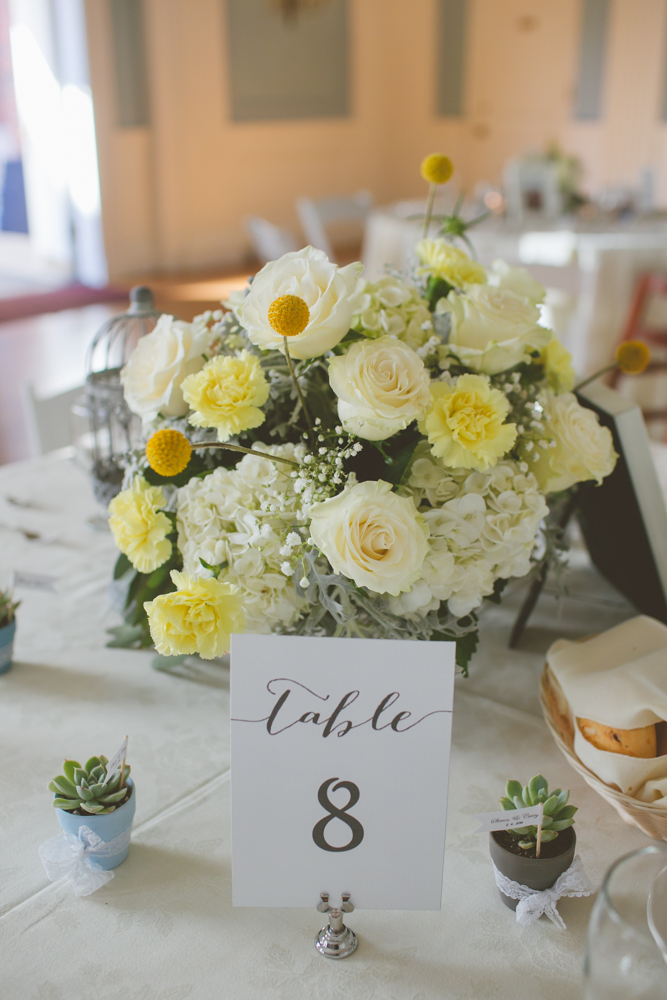 yellow and white roses centerpiece