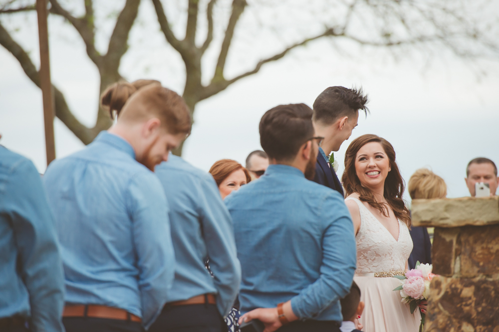 bride looks at groom
