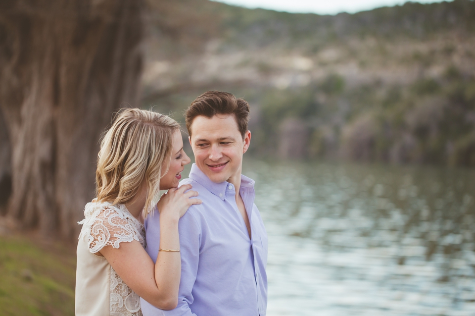 close up of engaged couple near water