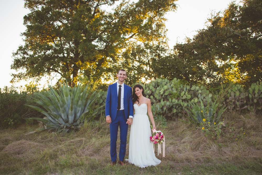 Bride and groom near cacti