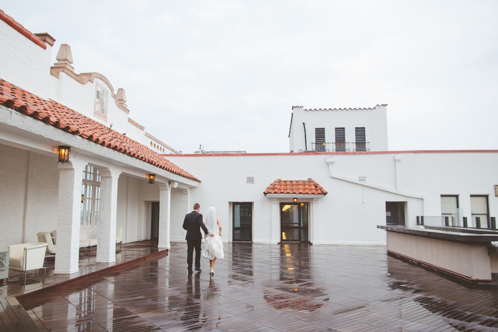 Bride and Groom in the rain on rooftop