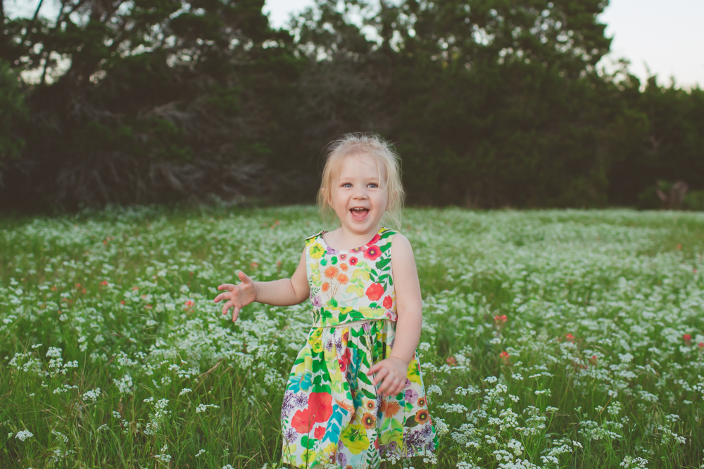 toddler in a field of flowers