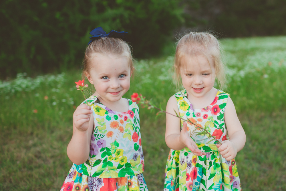 sisters holding flowers
