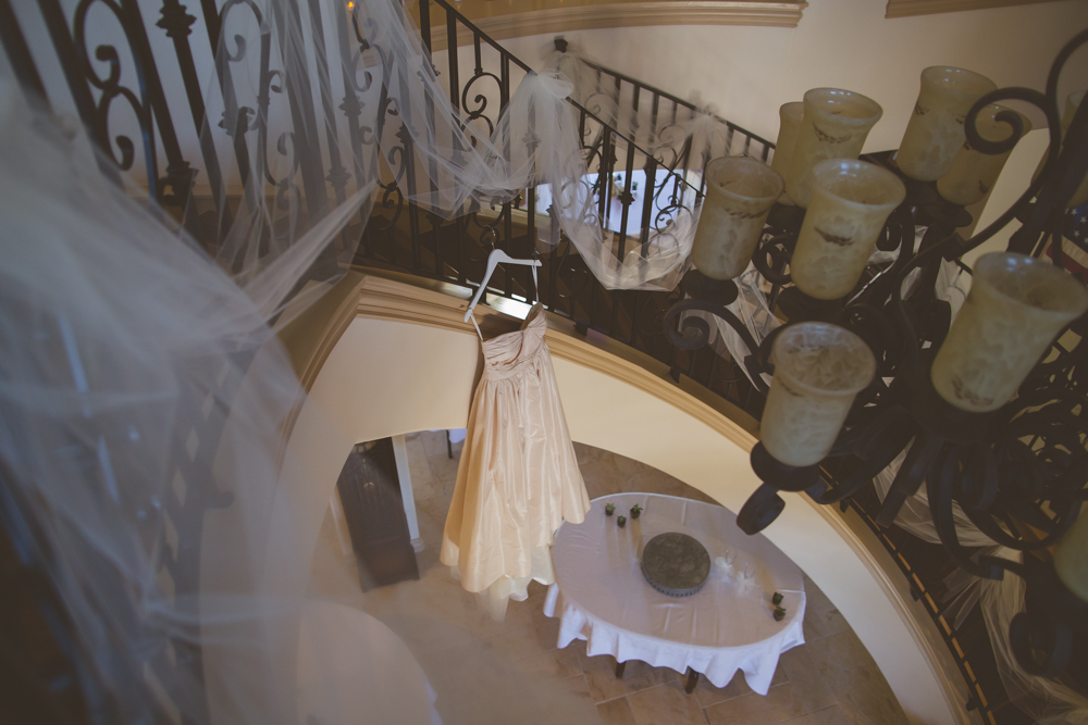 Bride's Dress Hanging over Balcony