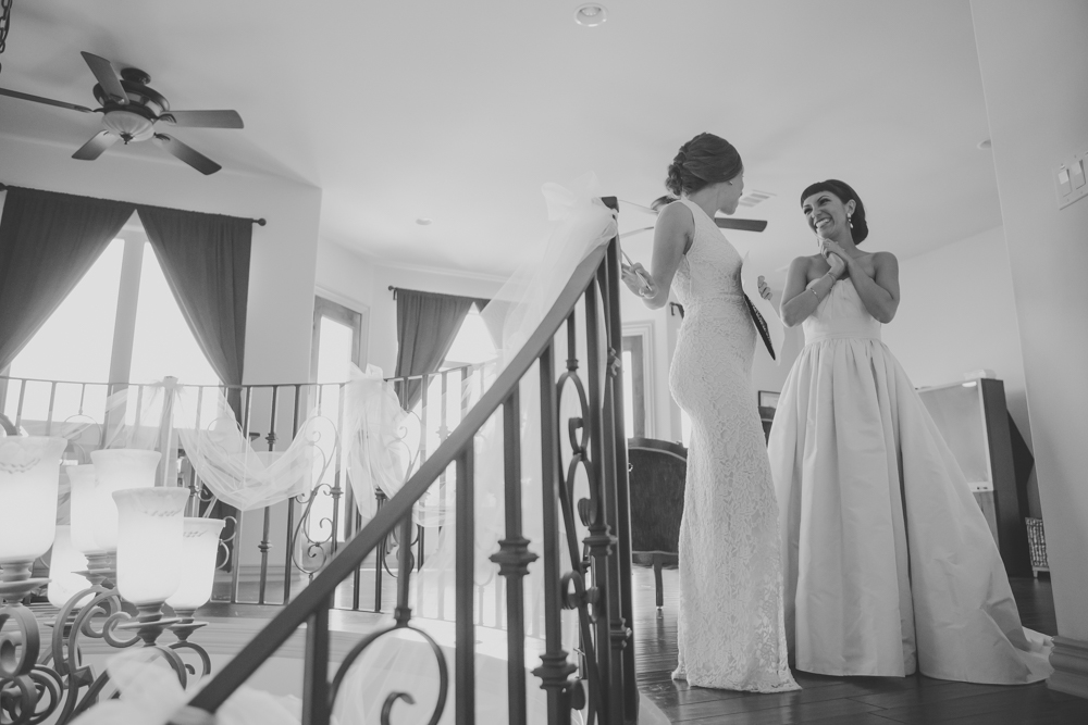 bride with bridesmaid on stairs