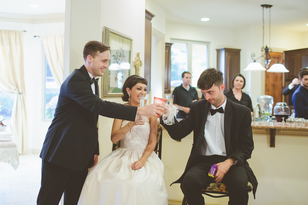 best man toasting bride and groom