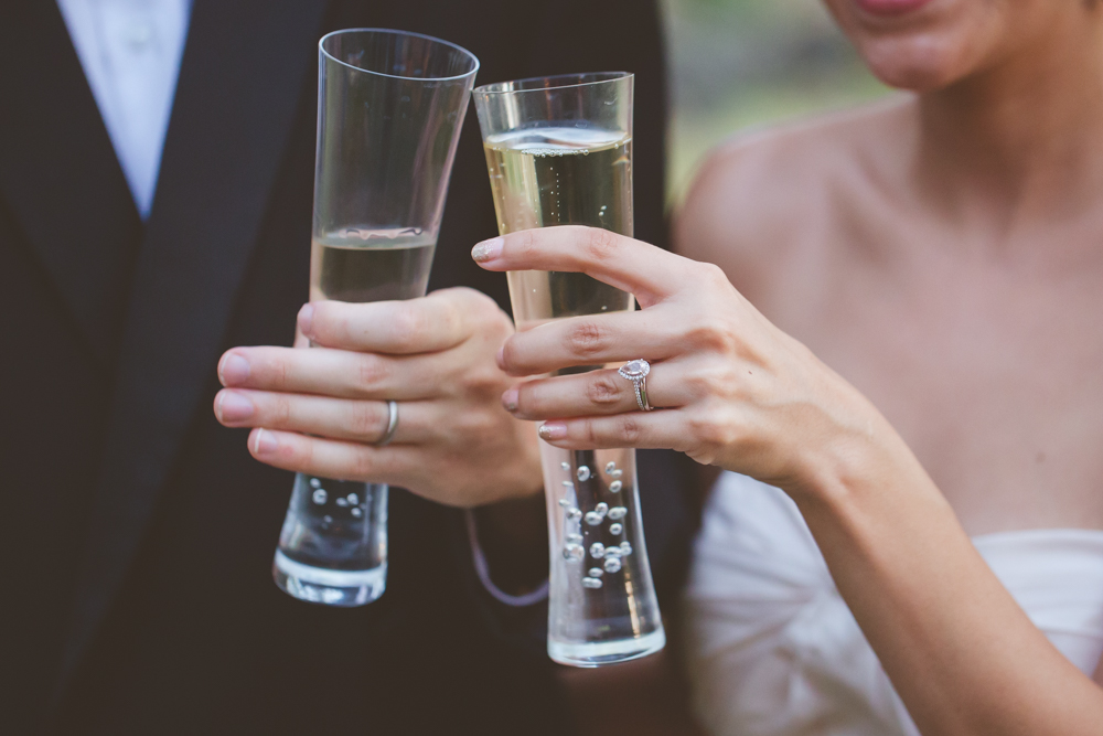 bride and groom toast close up on glasses