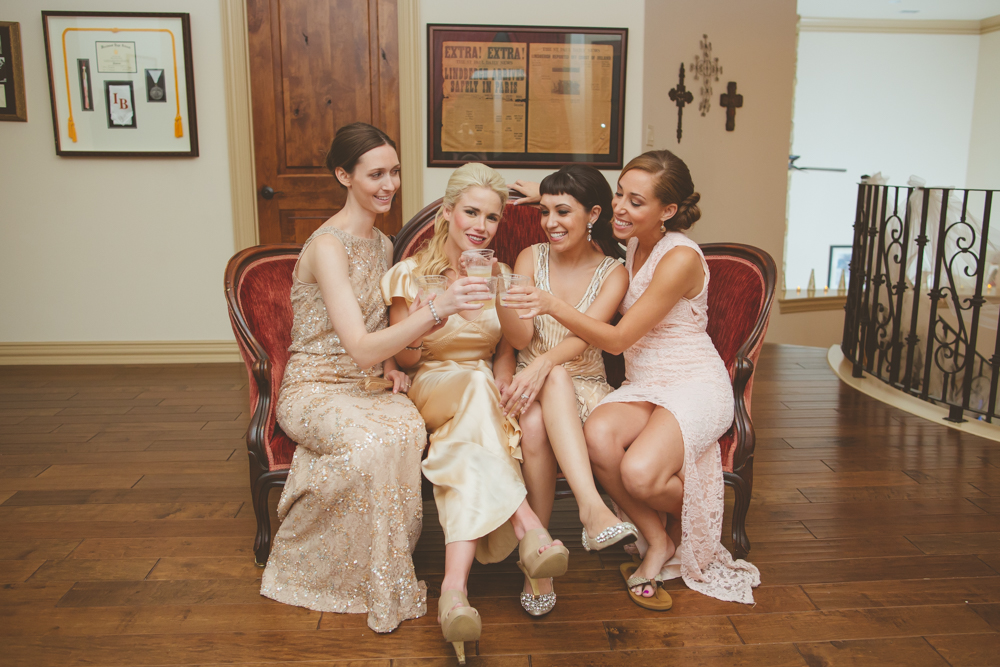 bride and bridesmaids toasting