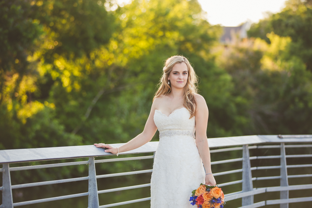 bride leaning on austin boardwalk