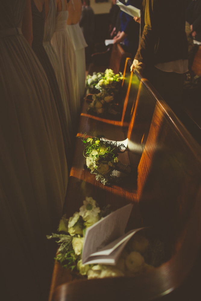 bouquets on the pew