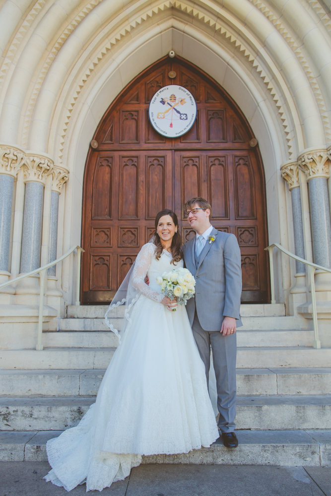 bride and groom in front of st. mary's cathedral