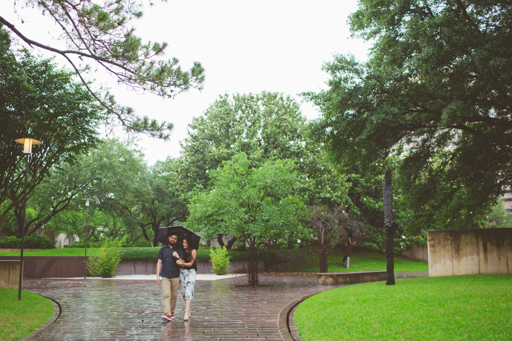 couple walking under umbrella
