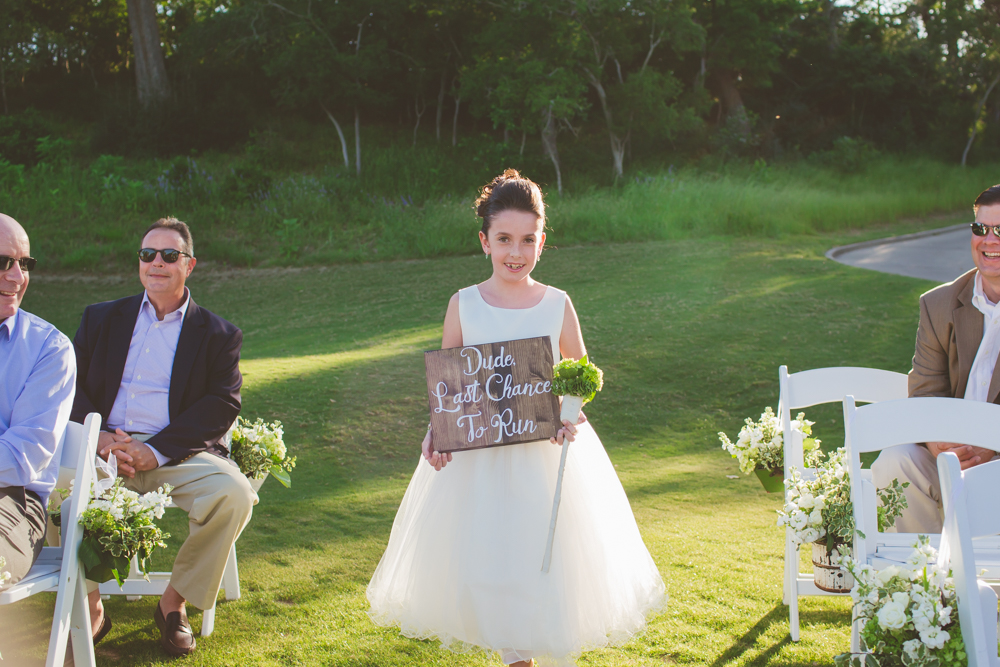 flower girl with funny sign