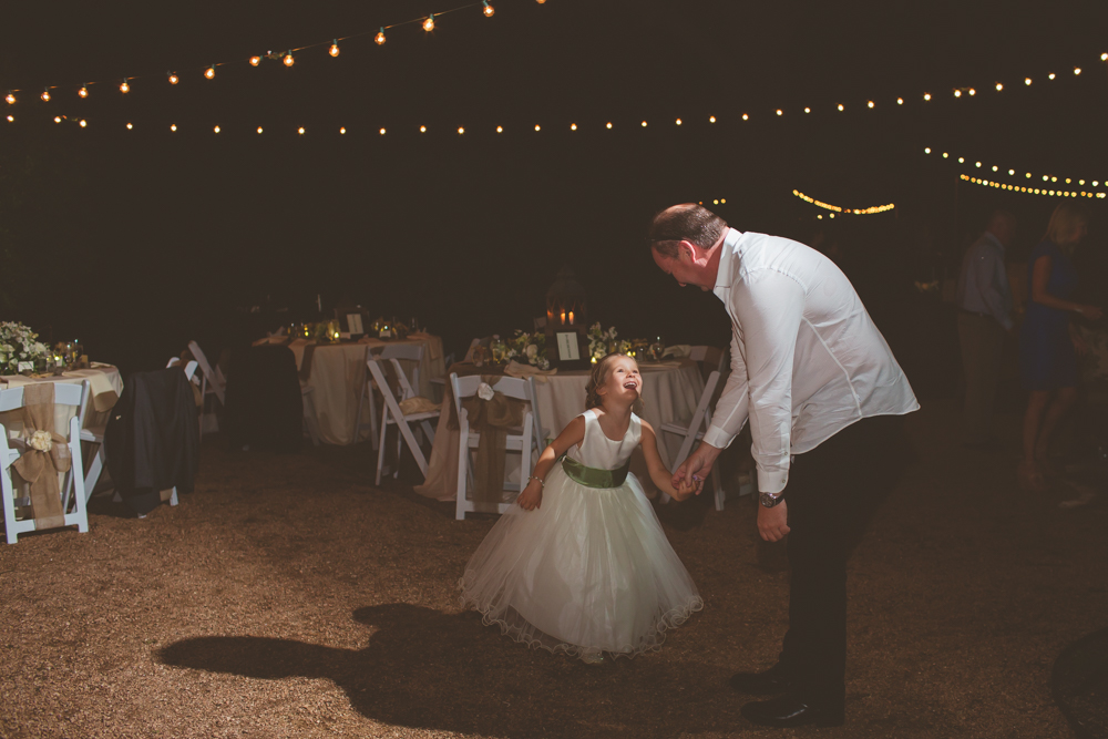 flower girl dancing with her dad