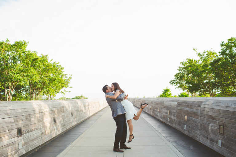 bride and groom hugging on Lamar Pedestrian Bridge