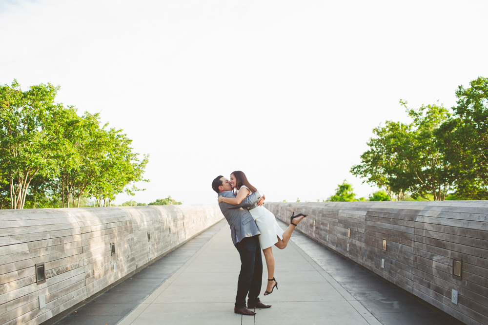 bride and groom hugging on Lamar Pedestrian Bridge