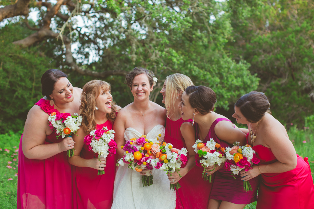 bridesmaids laughing with bride