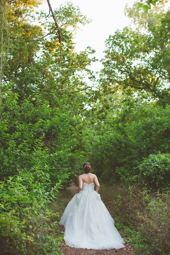 bride walking through the woods