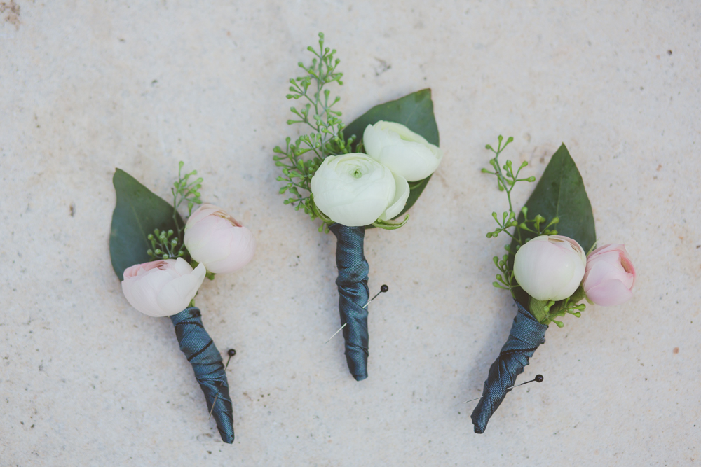 white and navy boutonnieres
