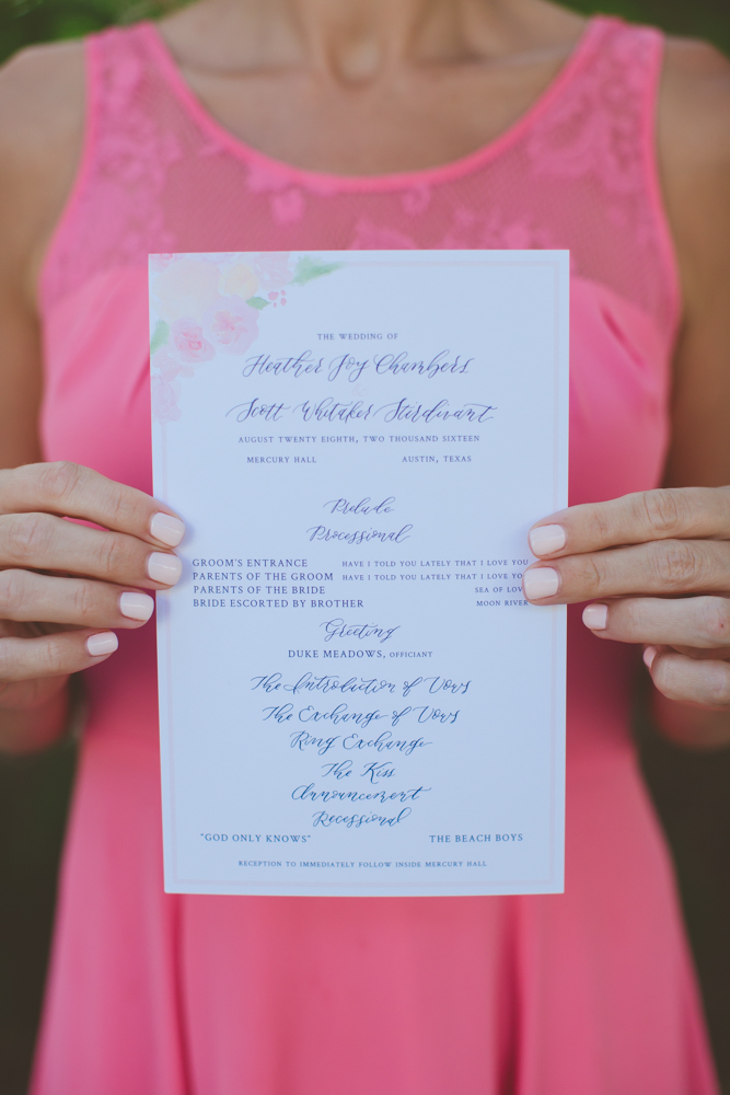 wedding invitation held by bridesmaid