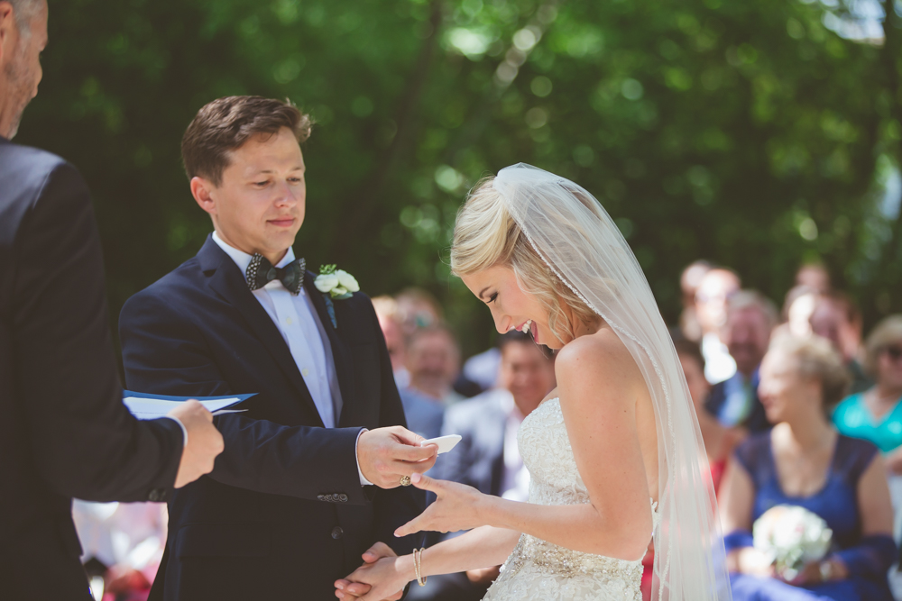 groom handing bride handkerchief
