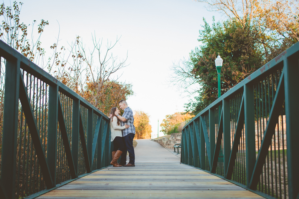 couple standing on a bridge