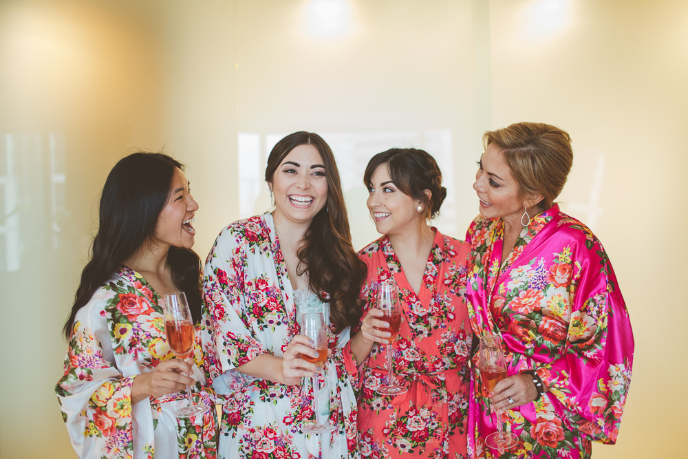 Bride and Bridesmaids Drinking Champagne
