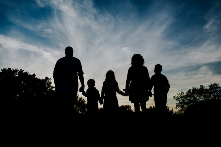 silhouette of family of five