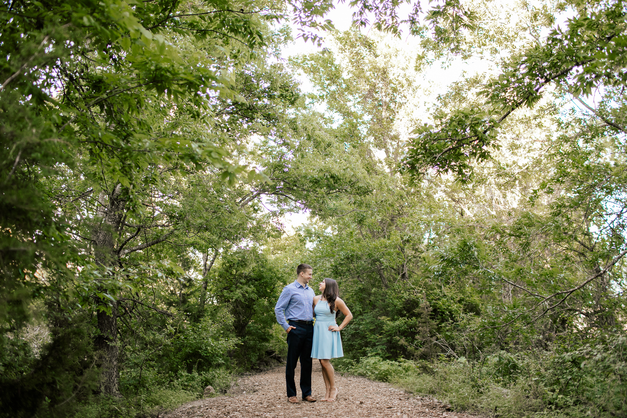 engaged couple in the forest