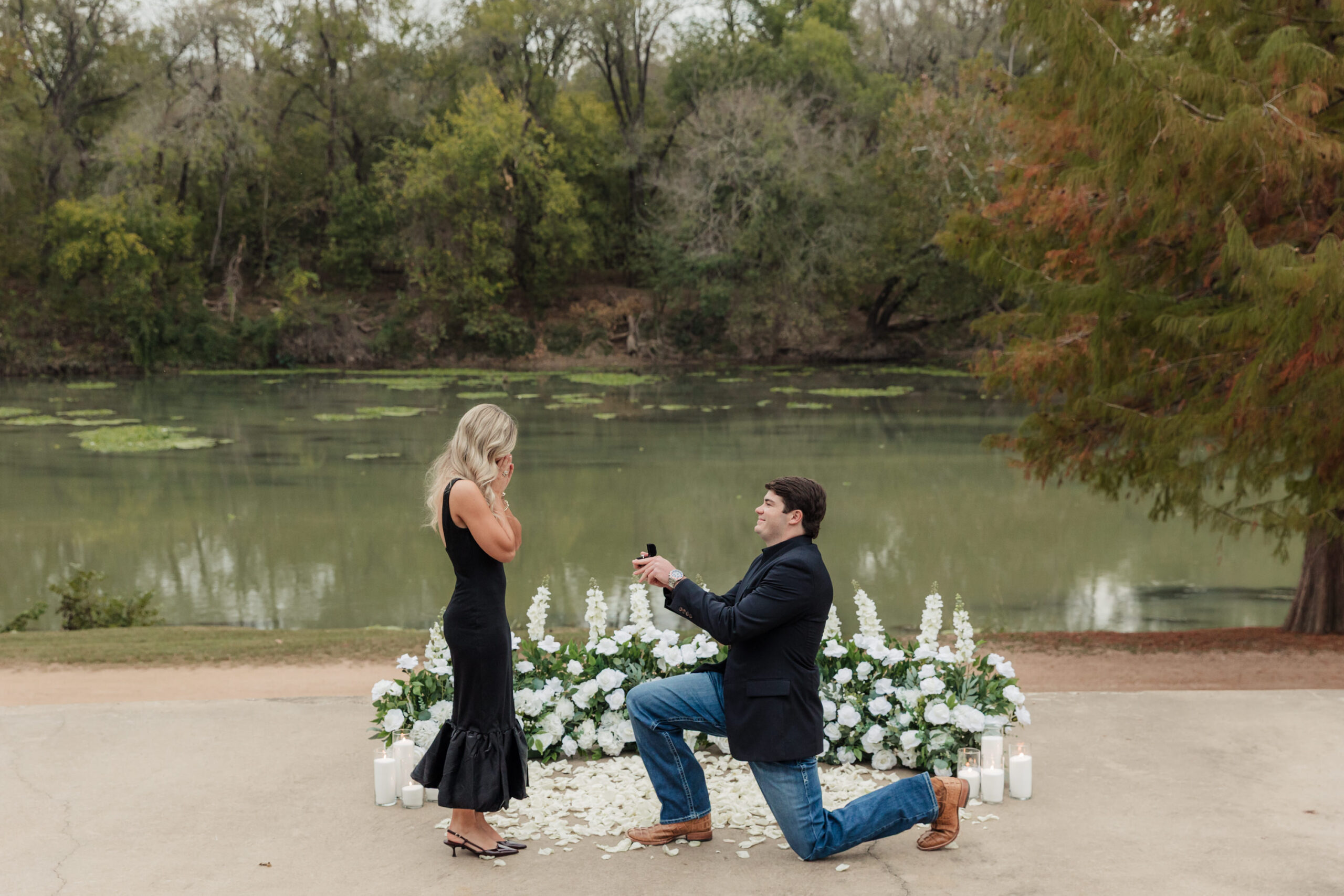 Proposal in front of Colorado River with white flowers