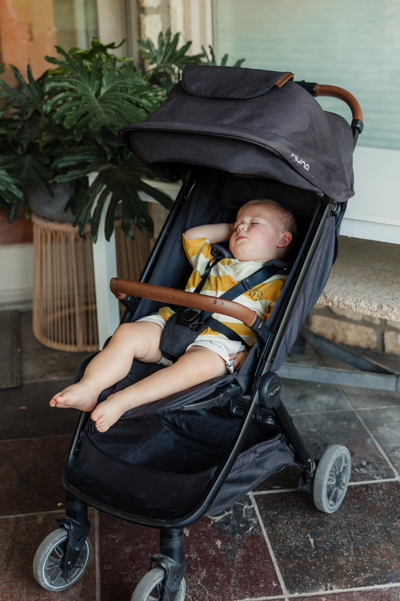 baby sleeping in stroller