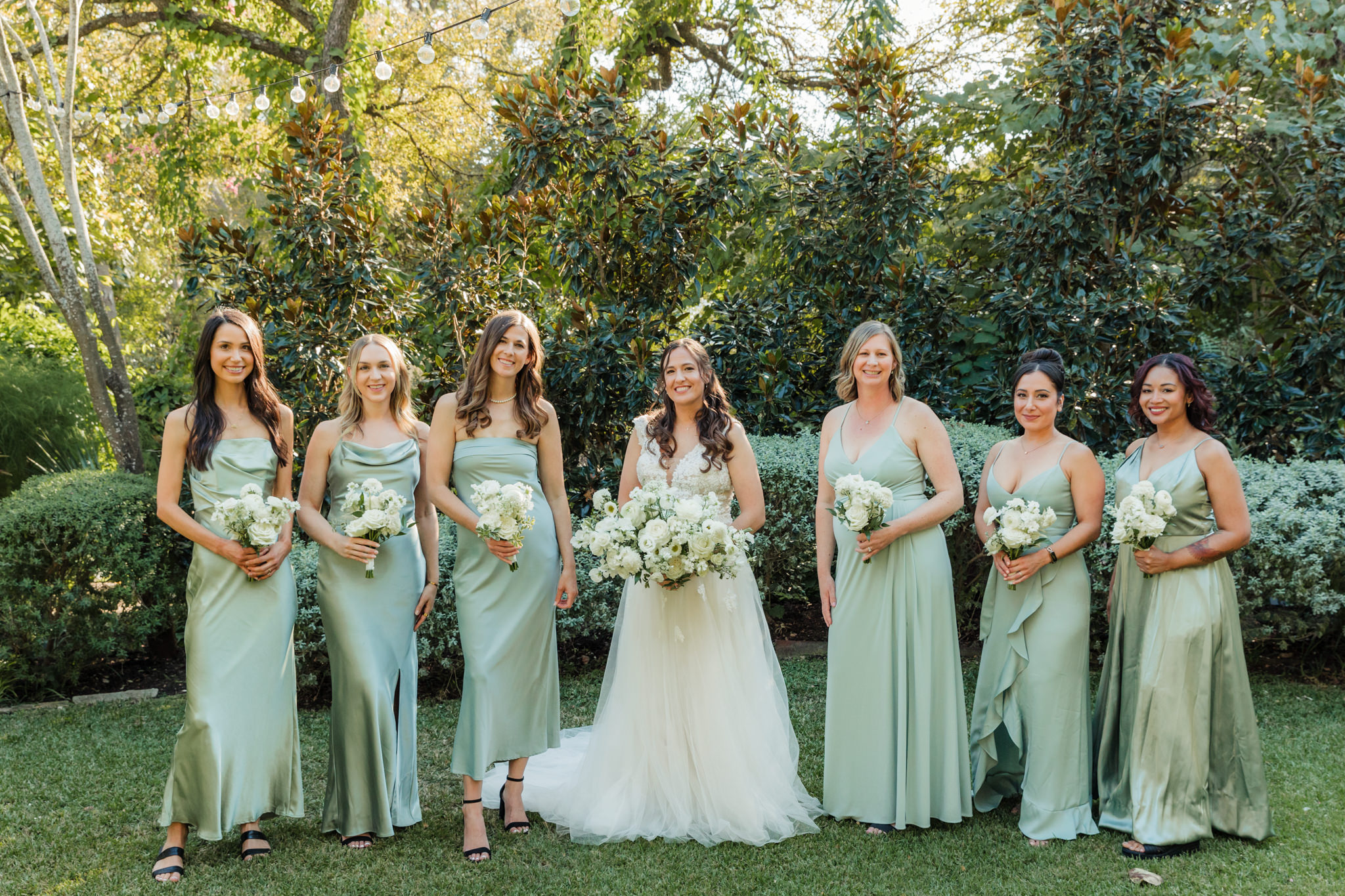 bride and bridesmaids in sage green dresses