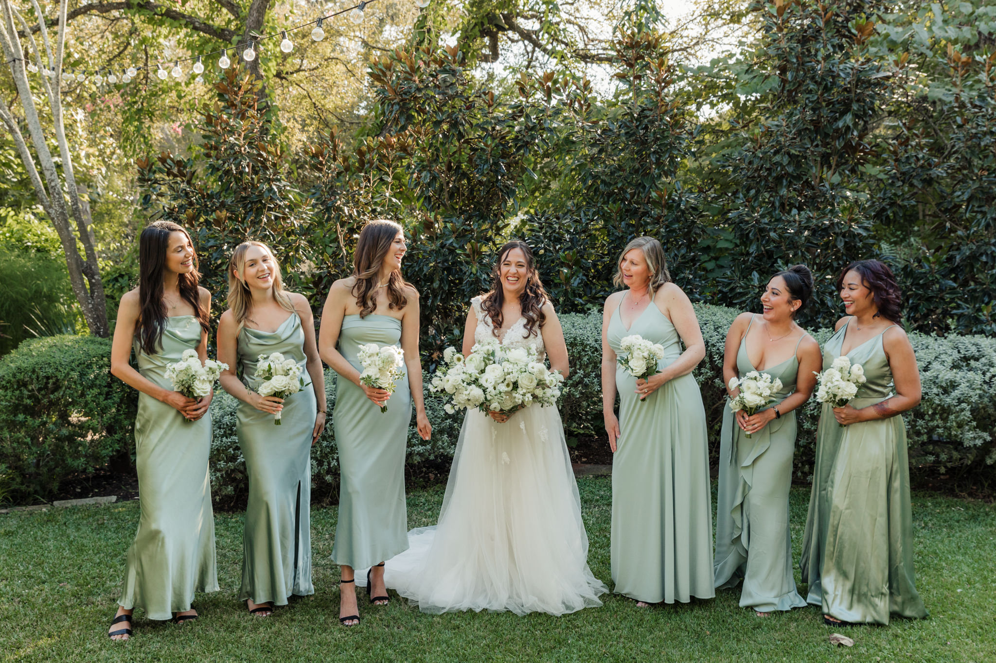 bride and bridesmaids in sage green dresses