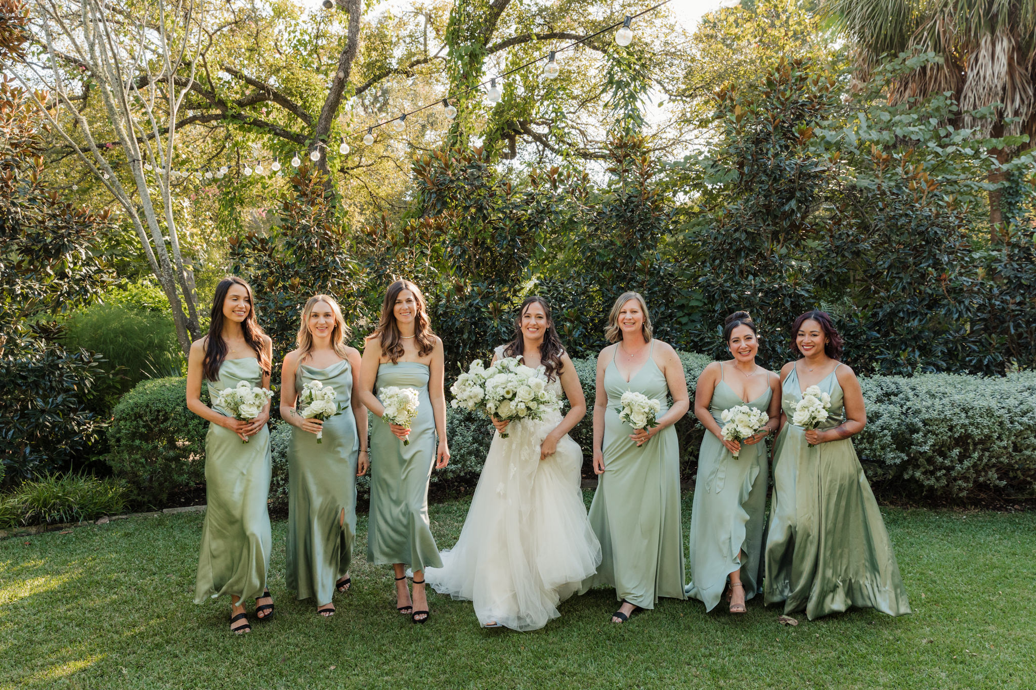 bride and bridesmaids in sage green dresses