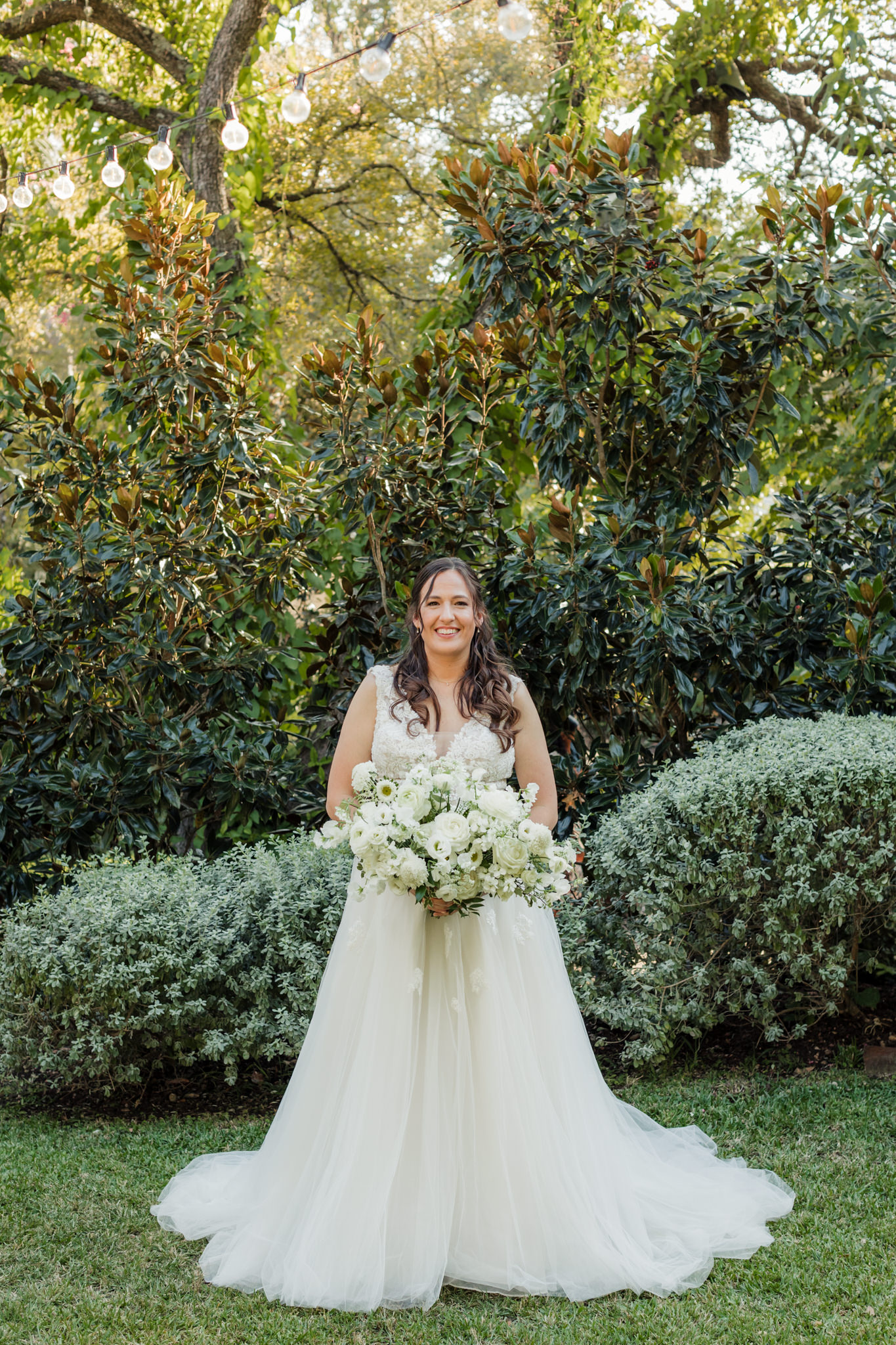 Hummingbird House bride with all white bouquet