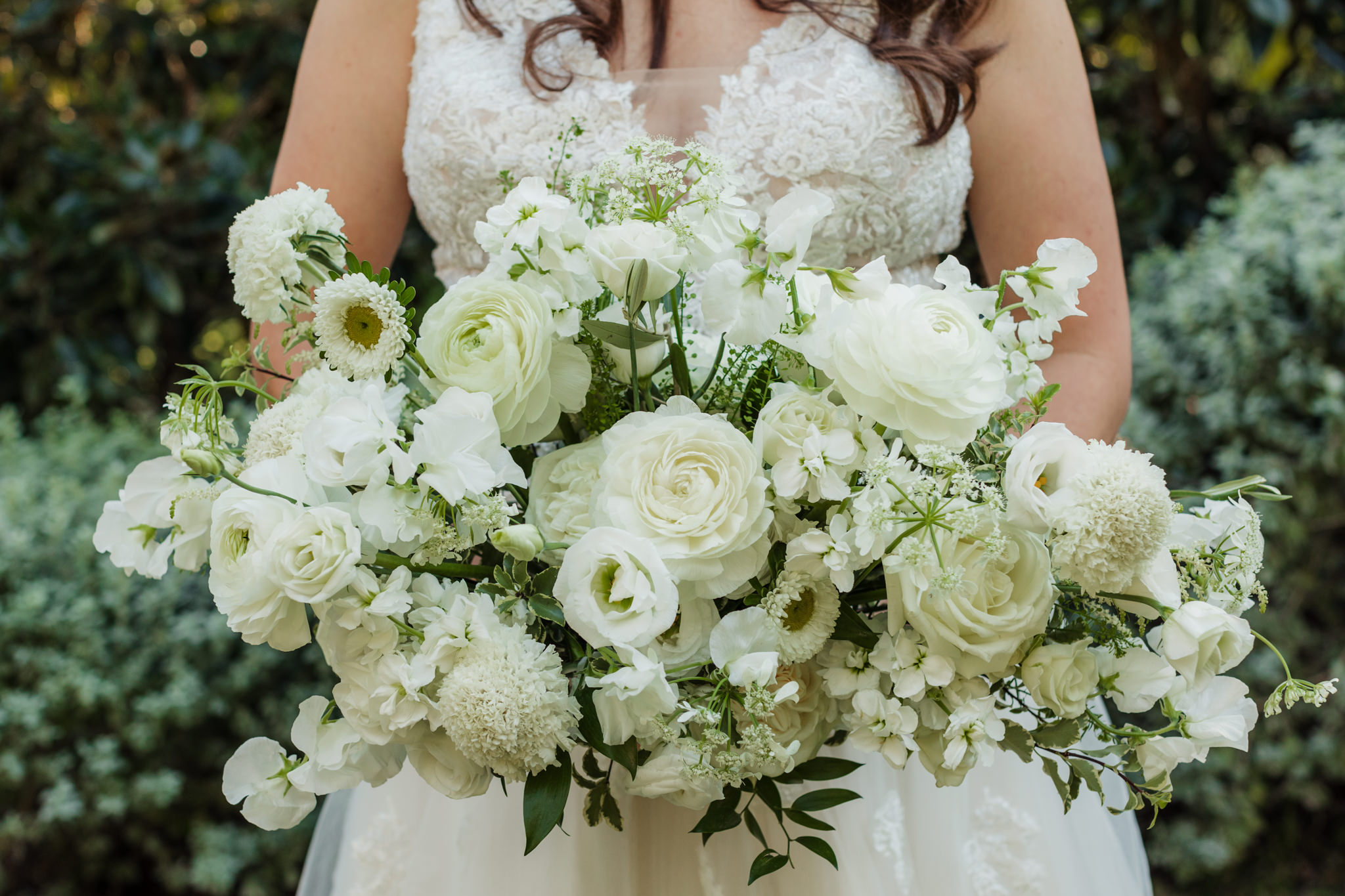 bride with all white flower bouquet