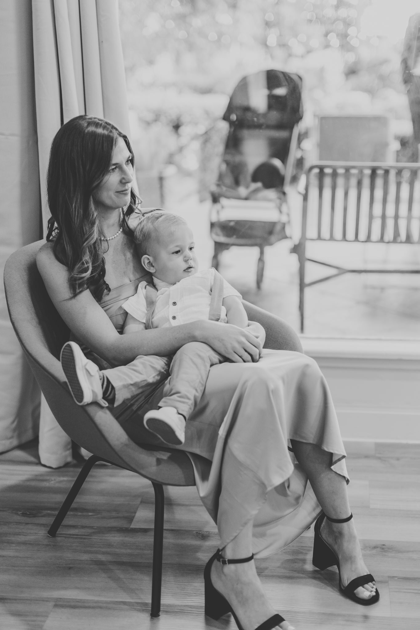 bridesmaid sitting with her son