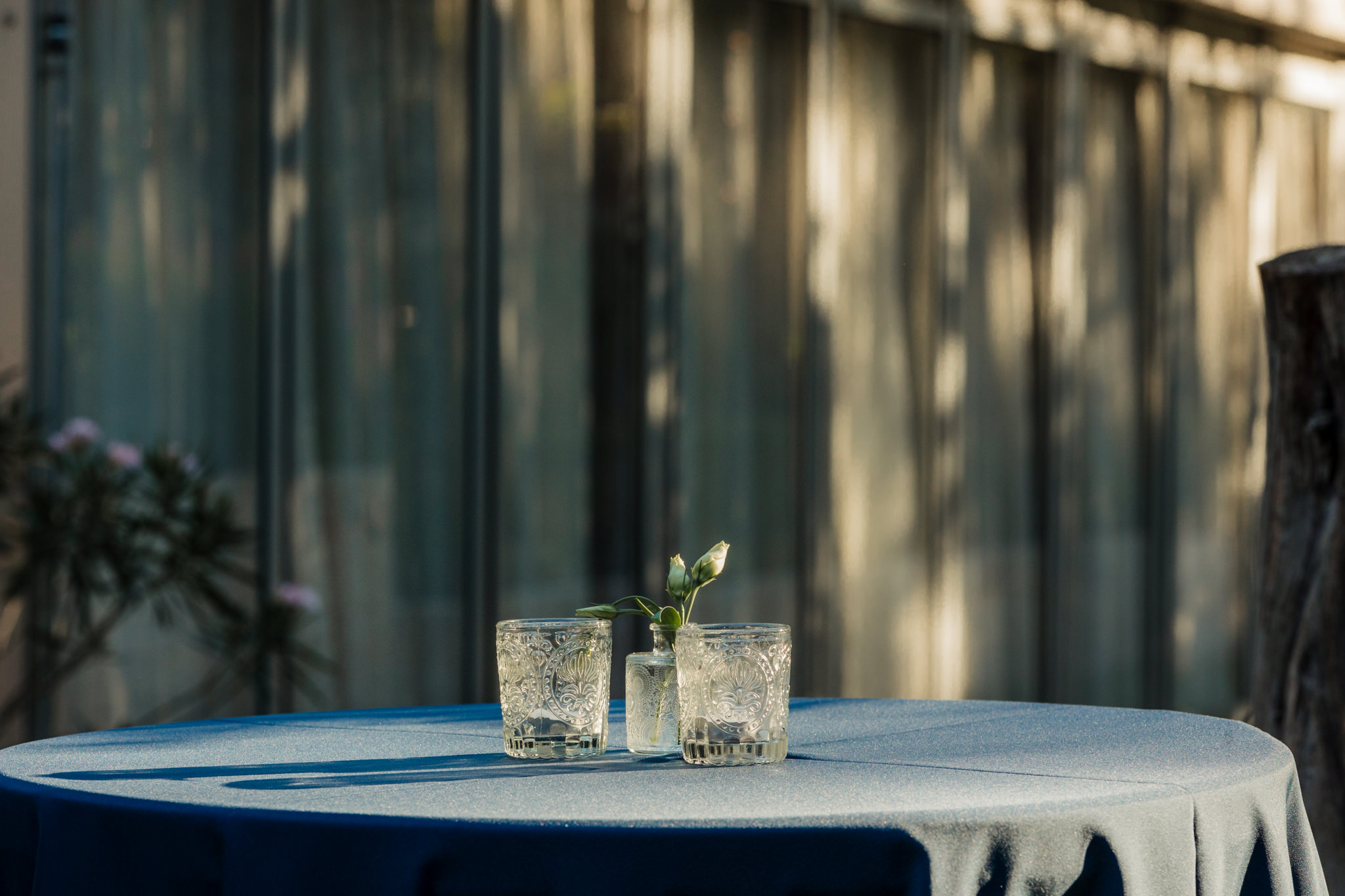 cocktail table with blue cloth and clear glasses