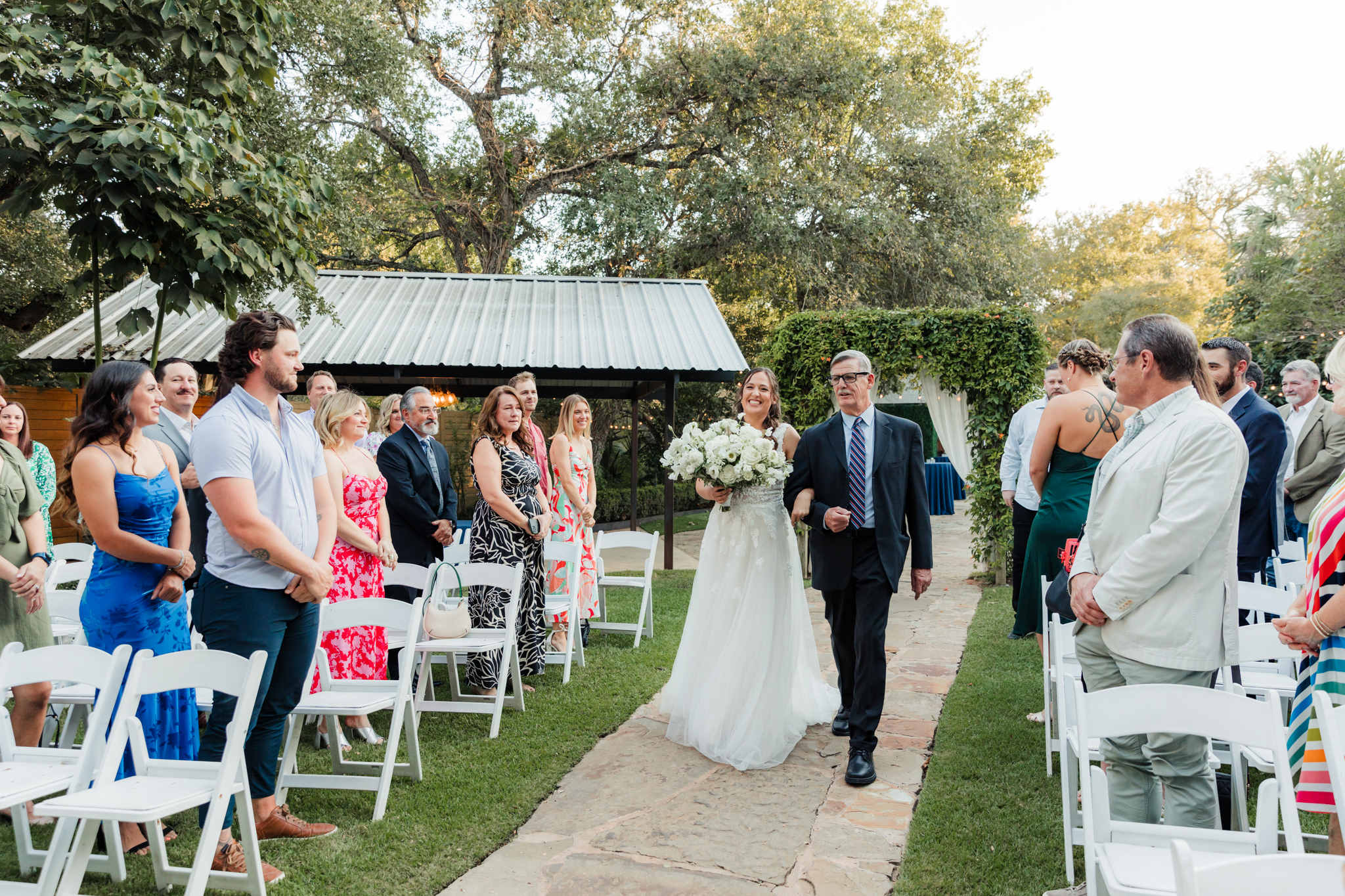 bride walking up the aisle with her dad