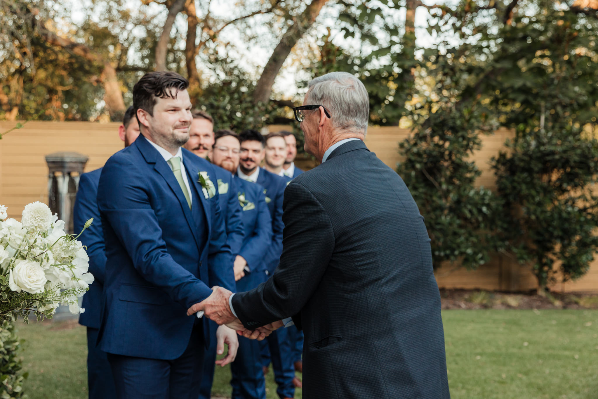 groom and bride's dad shaking hands