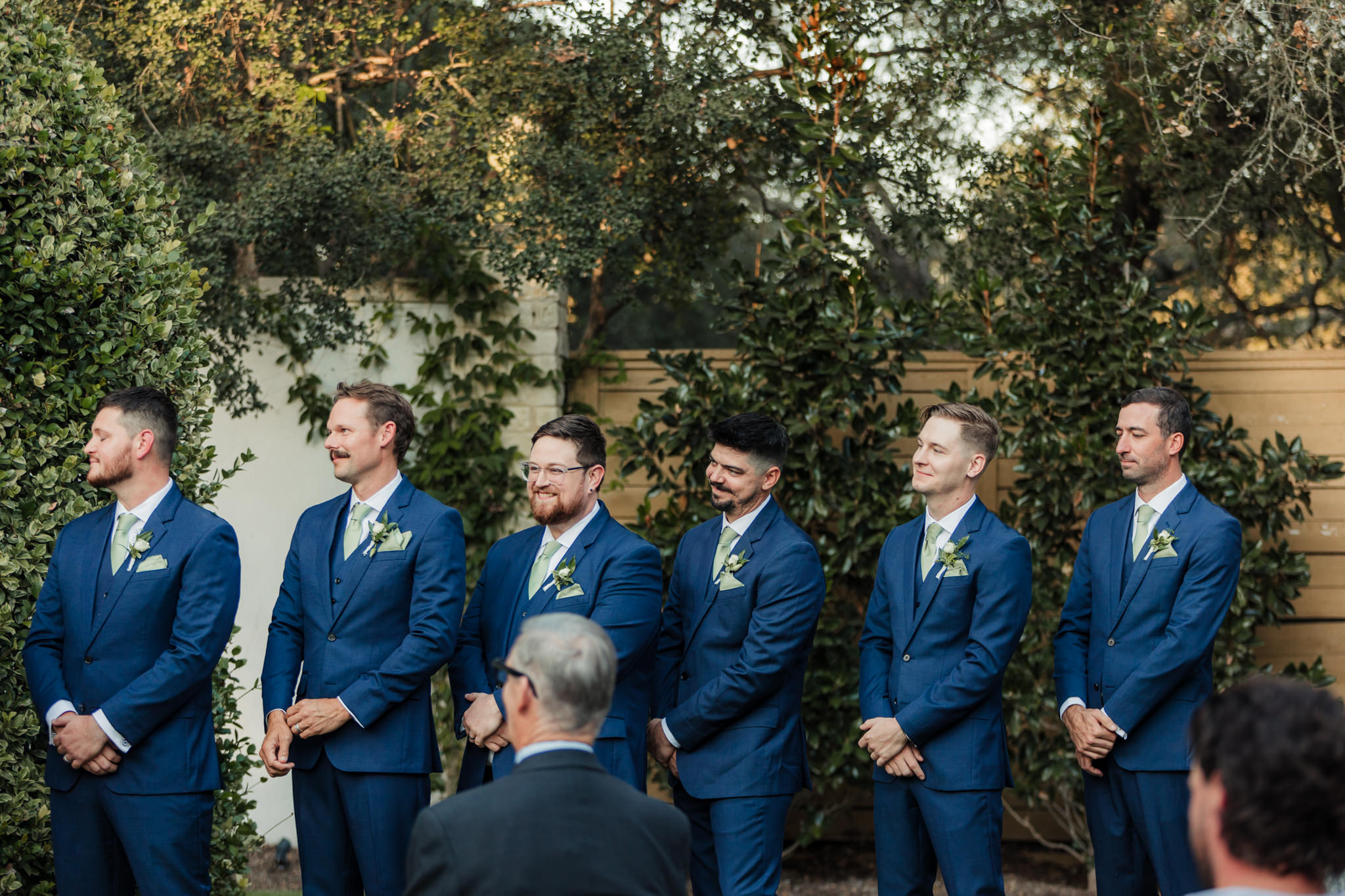 close up of groomsmen during ceremony