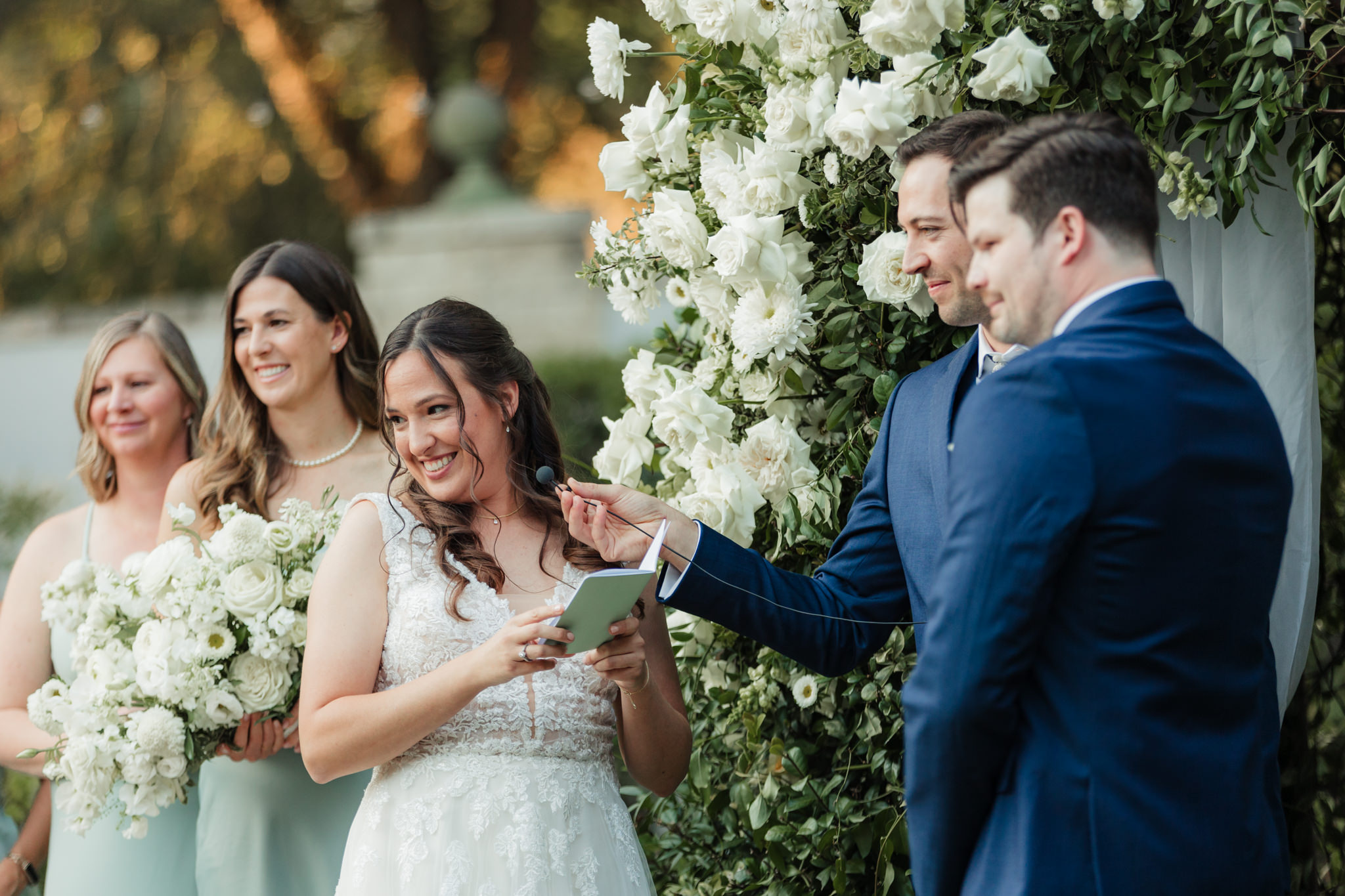 bride smiling at her son during ceremony