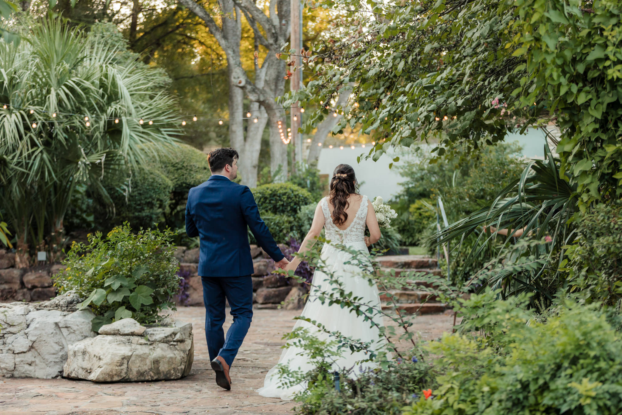 bride and groom recessional through the plants