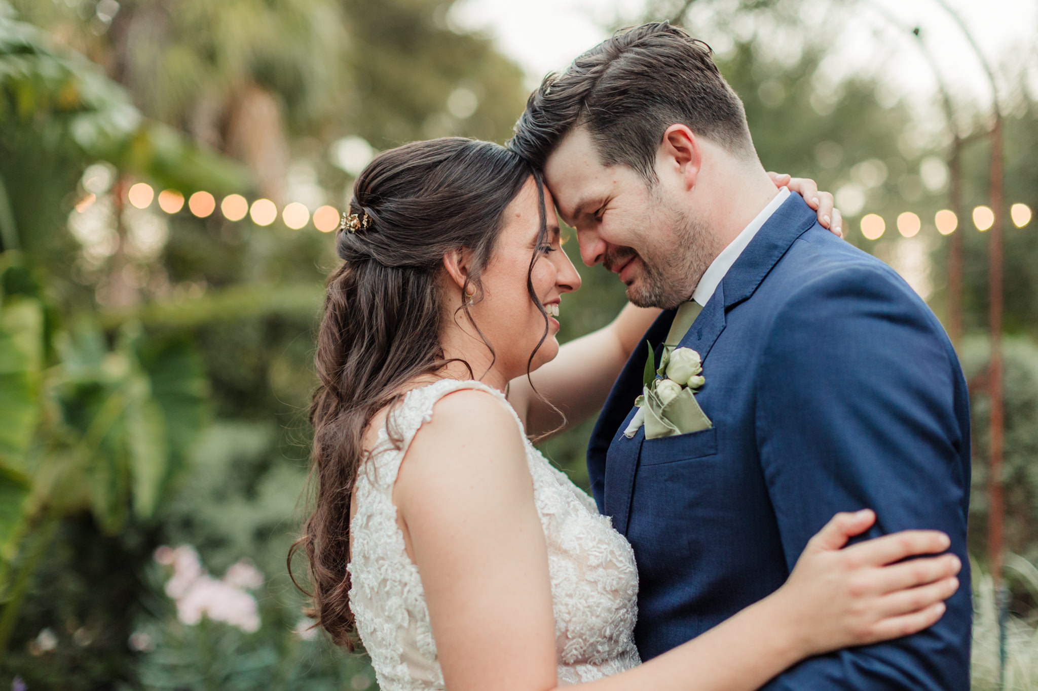 close up of bride and groom touching foreheads