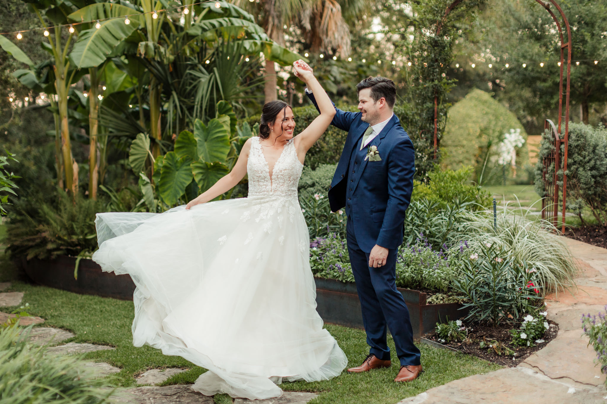 groom twirling bride