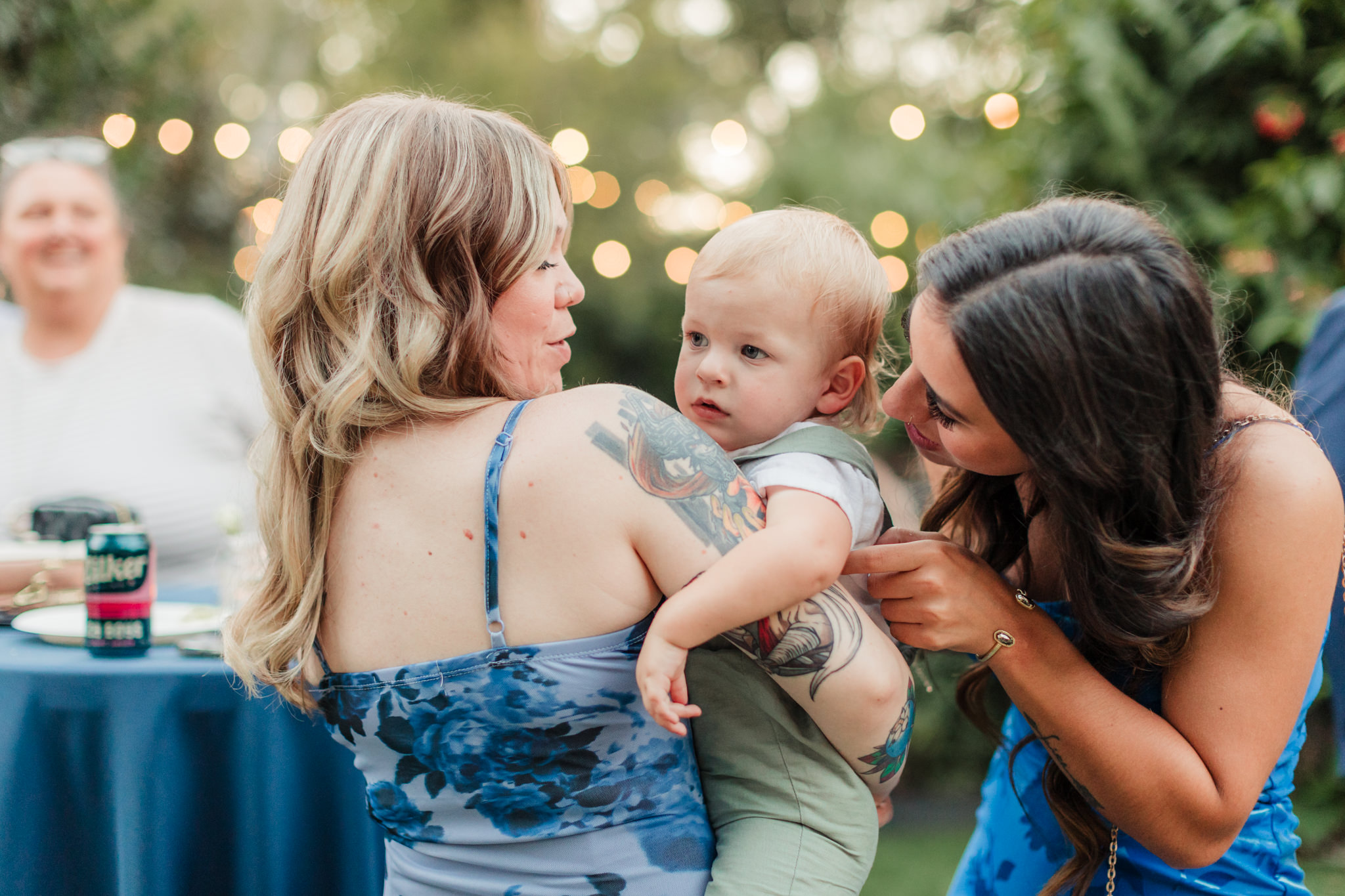 guests cuddling the ring bearer