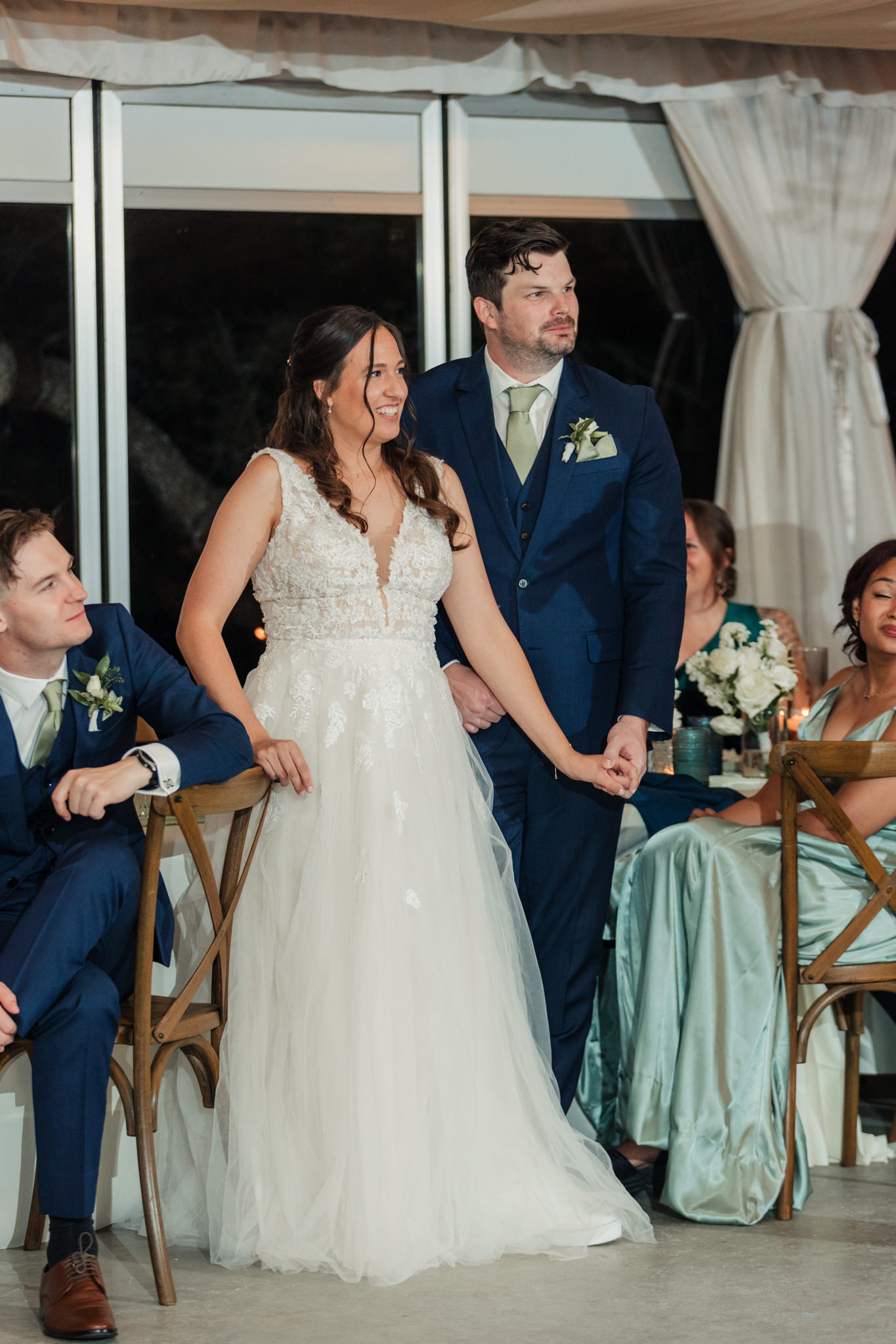 bride and groom laughing during toasts