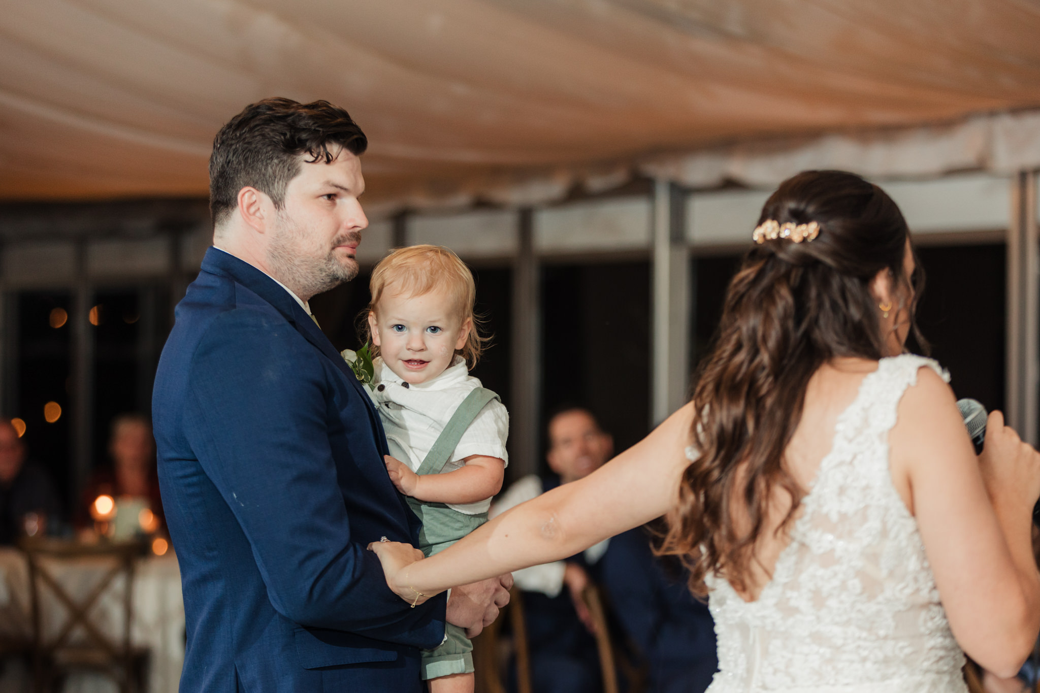 close up of ring bearer during toasts