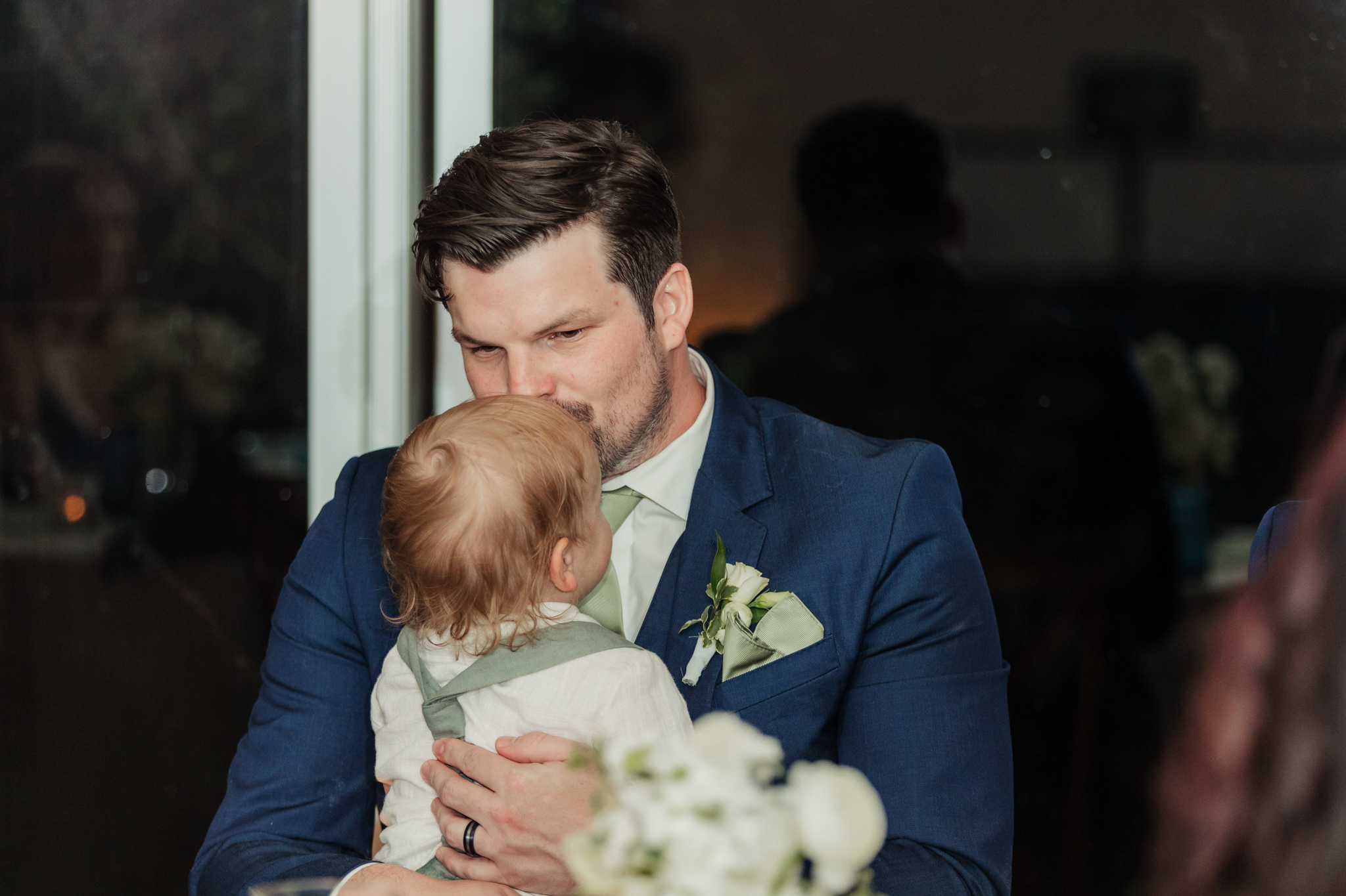 groom kissing ring bearer