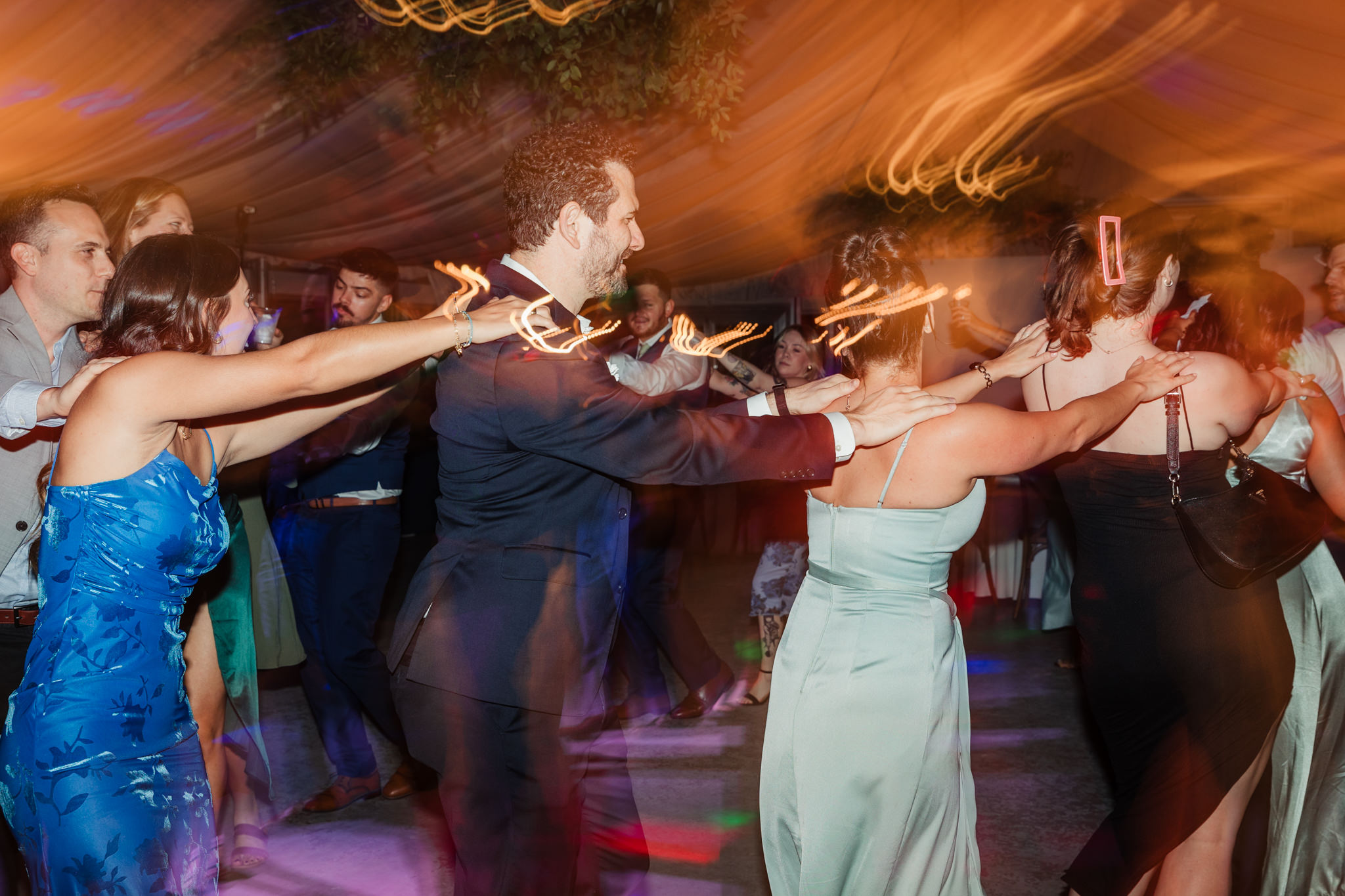 wedding guests doing conga line